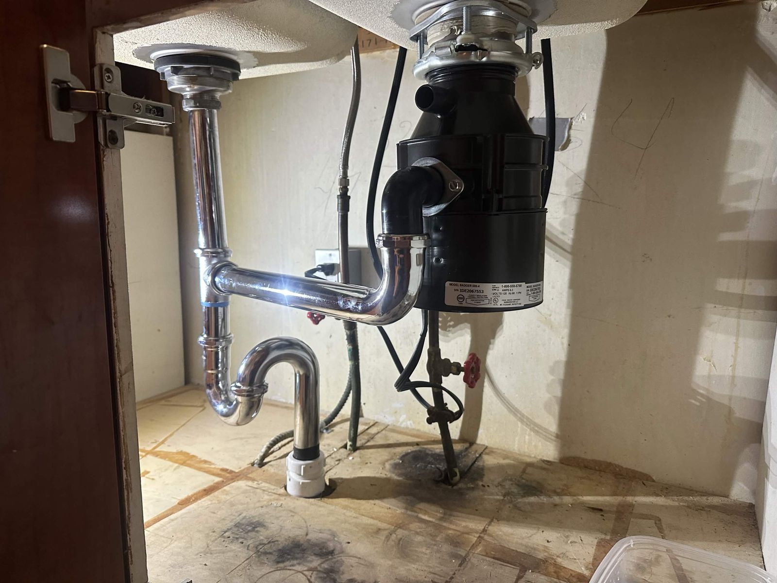 New kitchen sink drain and garbage disposal hookup.
